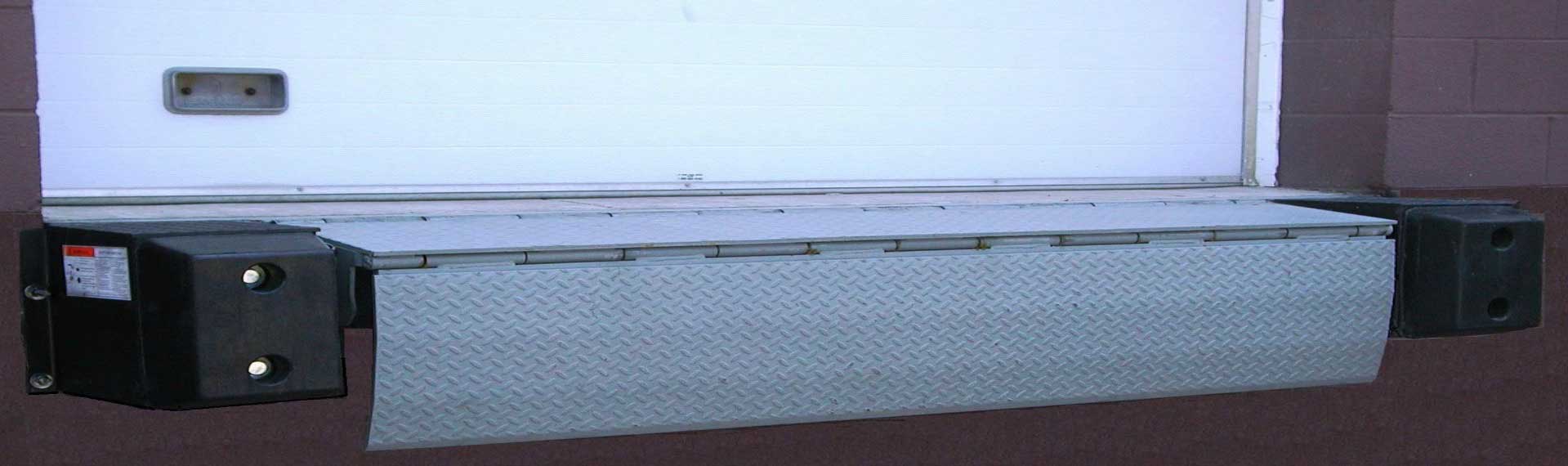YARD-RAMP-SITE edge of dock leveler without truck at dock loading